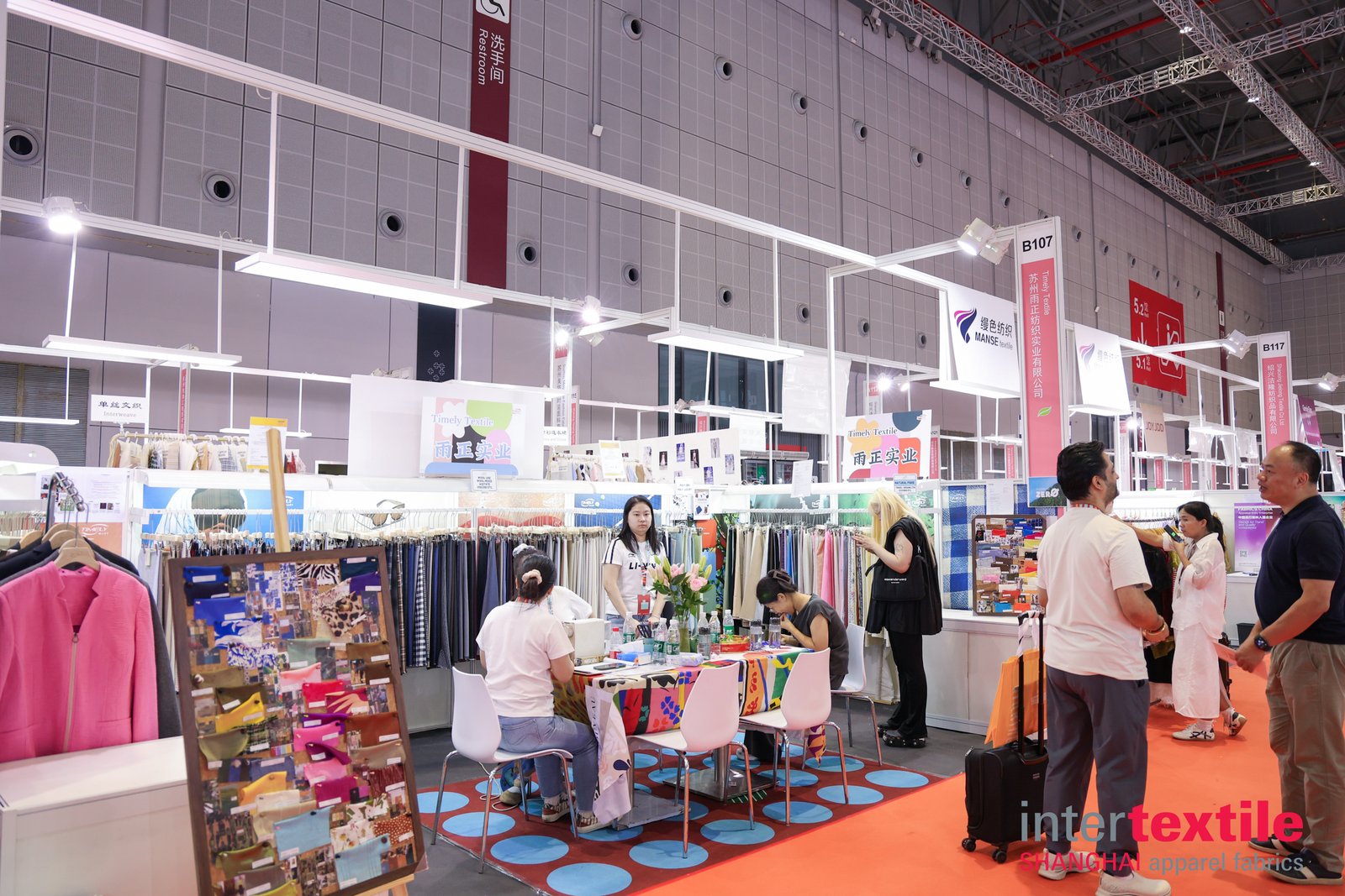 Textile exhibitors at Intertextile Shanghai 2026 Fabric exhibitors and visitors on the Intertextile Shanghai 2026 exhibition floor